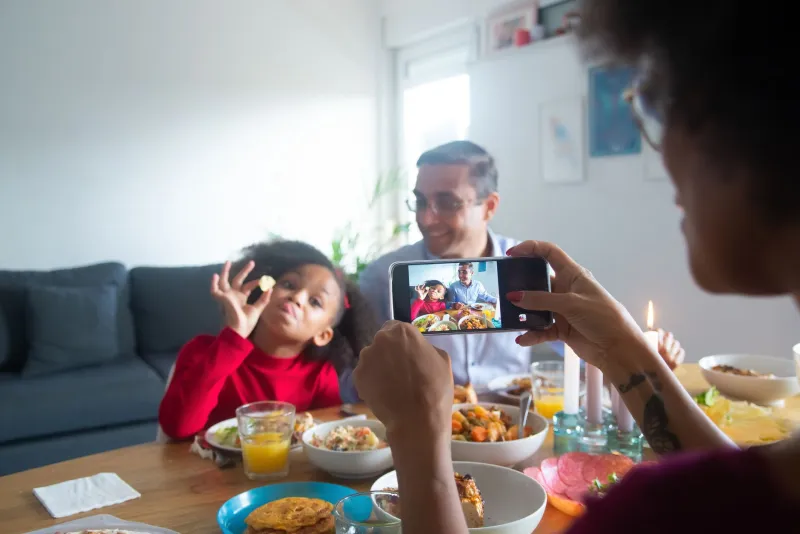 Six People Around a Table, Six Screens in Their Hands